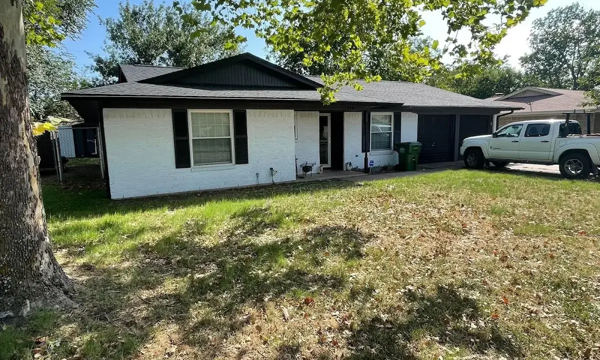 Professional roofing crew working on a residential roof in Tacoma